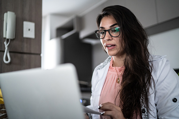 young adult female on laptop