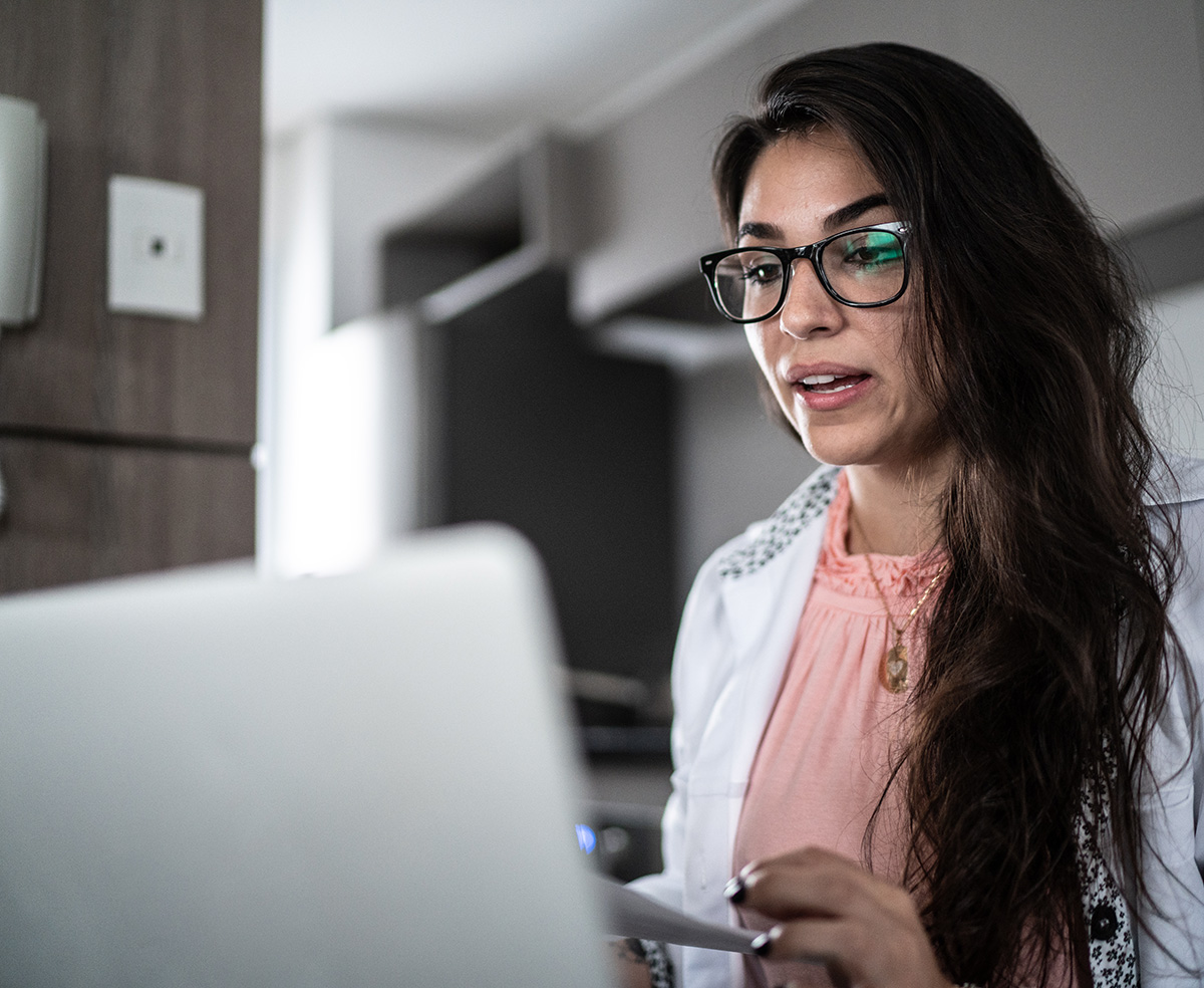 young adult female on laptop