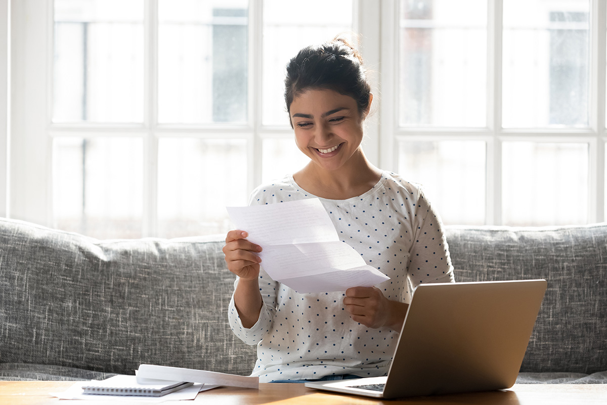 happy woman reading a letter