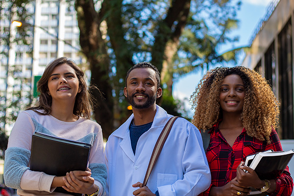 Group of three young diverse students