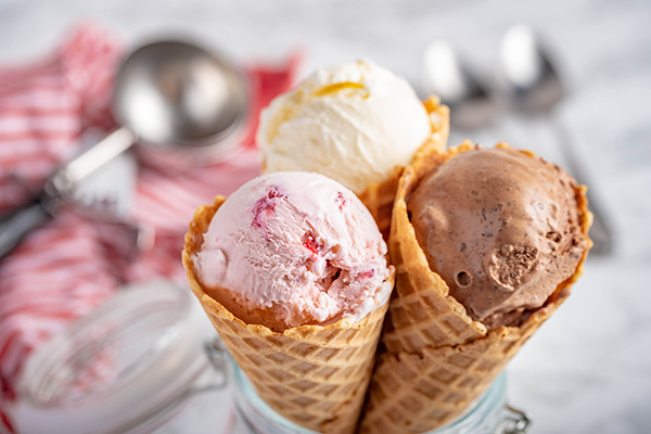 three ice cream cones with a single scoop in each