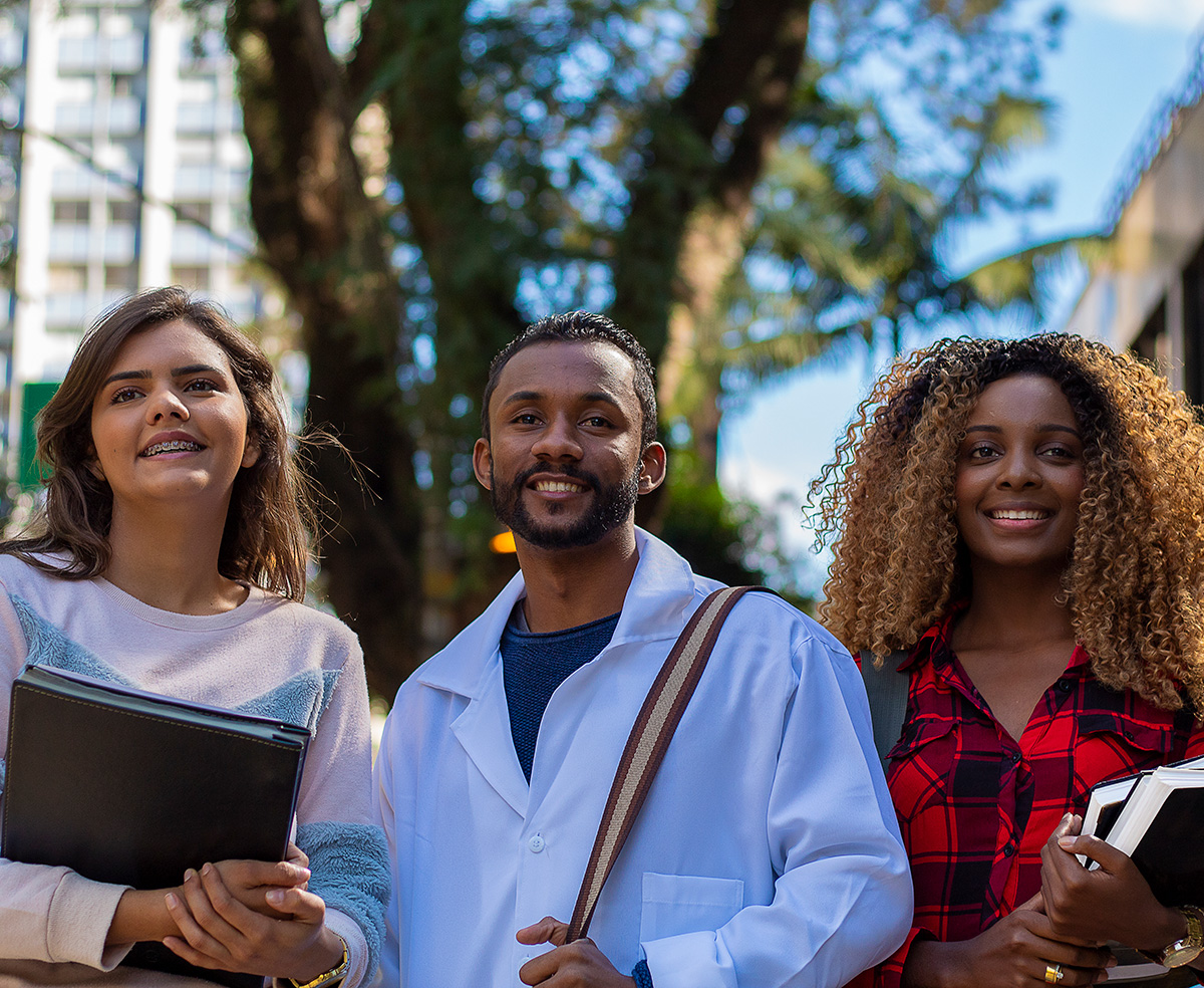 Group of three young diverse students